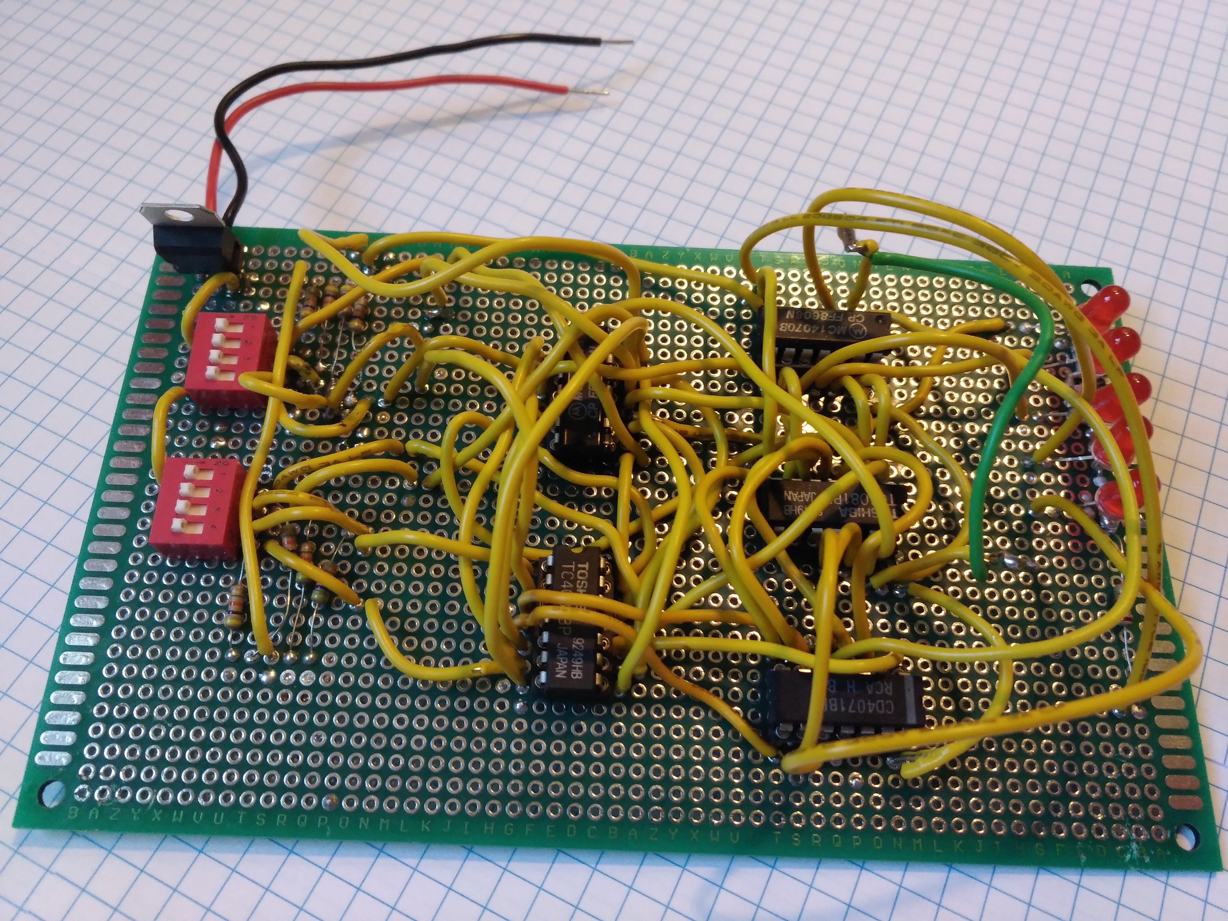 Photo of the finished 4 bit adder soldered onto a perforated PCB.